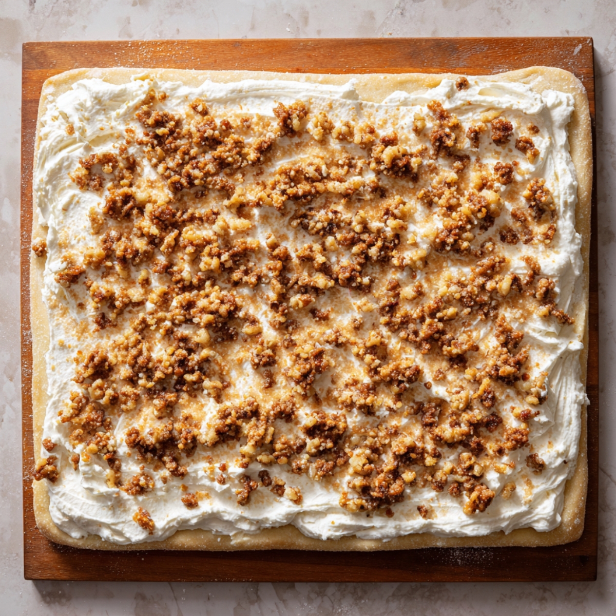 The dough edges folded over and rolled into a tight log, seams pinched to seal in the filling.