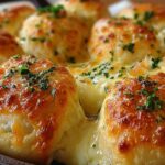 Freshly baked cheesy Garlic Cheese Rolls, golden and sprinkled with chopped parsley.