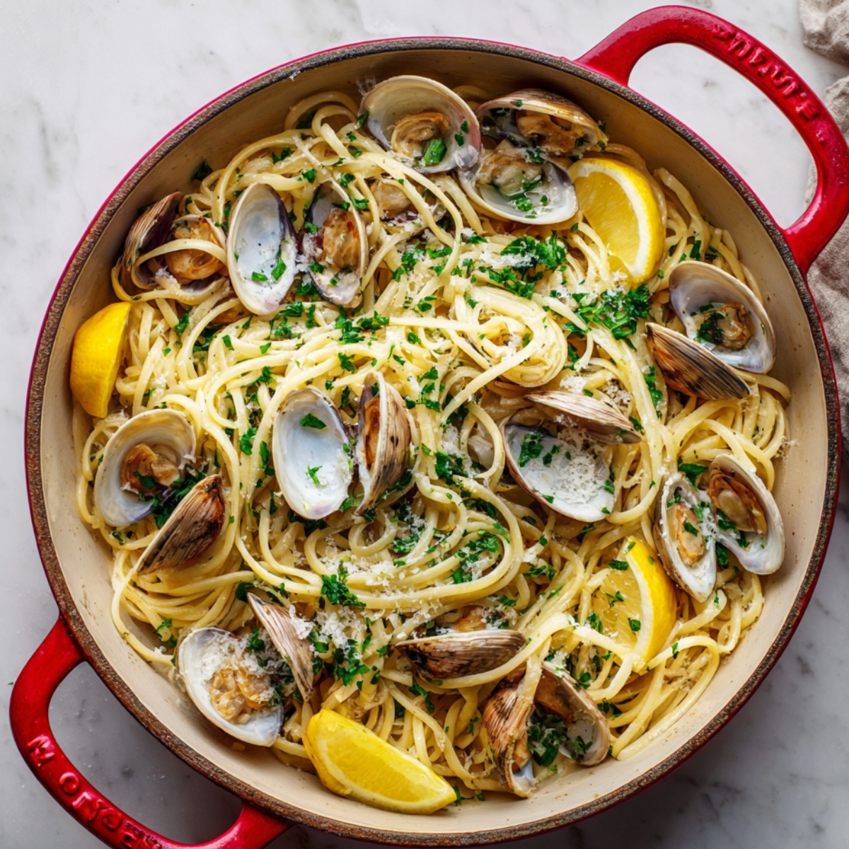 Finish the dish with a squeeze of lemon juice. Once your linguine and clams are combined and the flavors have melded, add a generous squeeze of fresh lemon juice. This will brighten up the dish and enhance the natural brininess of the clams, providing a refreshing burst of citrus.
