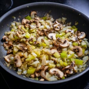 Delicious Chicken Wild Rice Casserole Recipe 16 "Skillet sautéing chopped onions, celery, and sliced mushrooms until tender and fragrant."