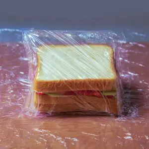 Japanese Fruit Sandwich Recipe (Ready in 10 Minutes!) 17 "A fruit sandwich neatly wrapped in plastic wrap, preserving its freshness while holding together the layers of whipped cream and fruit."