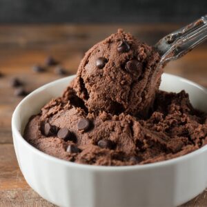 Easy Brookies Cookies Recipe | Half Cookie, Half Brownie 16 Rich chocolate cookie dough with chocolate chips in a white bowl, scooped with a metal cookie scoop.