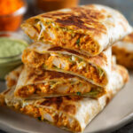 Chicken Crunch Wrap Professional food photography of sliced crispy chicken crunchwraps stacked on a plate, golden toasted tortilla, creamy orange chicken filling visible, dipping sauce on the side, shallow depth of field, restaurant-style presentation, ultra realistic