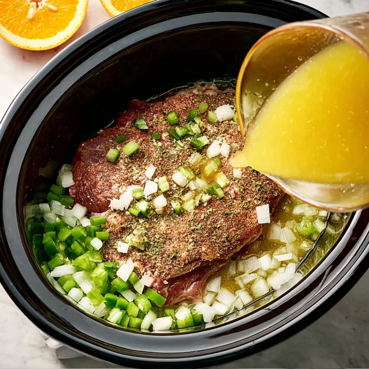 Carnitas Crockpot Recipe | 10 Ingredients, 8 Hours 11 Overhead shot of raw pork shoulder seasoned with spices inside a slow cooker, chopped onions and green peppers around the meat, orange juice being poured in, preparation stage of carnitas, clean modern kitchen, bright natural light, detailed realistic style