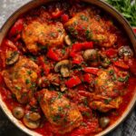 Chicken Cacciatore A delicious chicken cacciatore simmering in a rich tomato sauce with bell peppers, mushrooms, and herbs, perfect for a comforting, hearty meal.