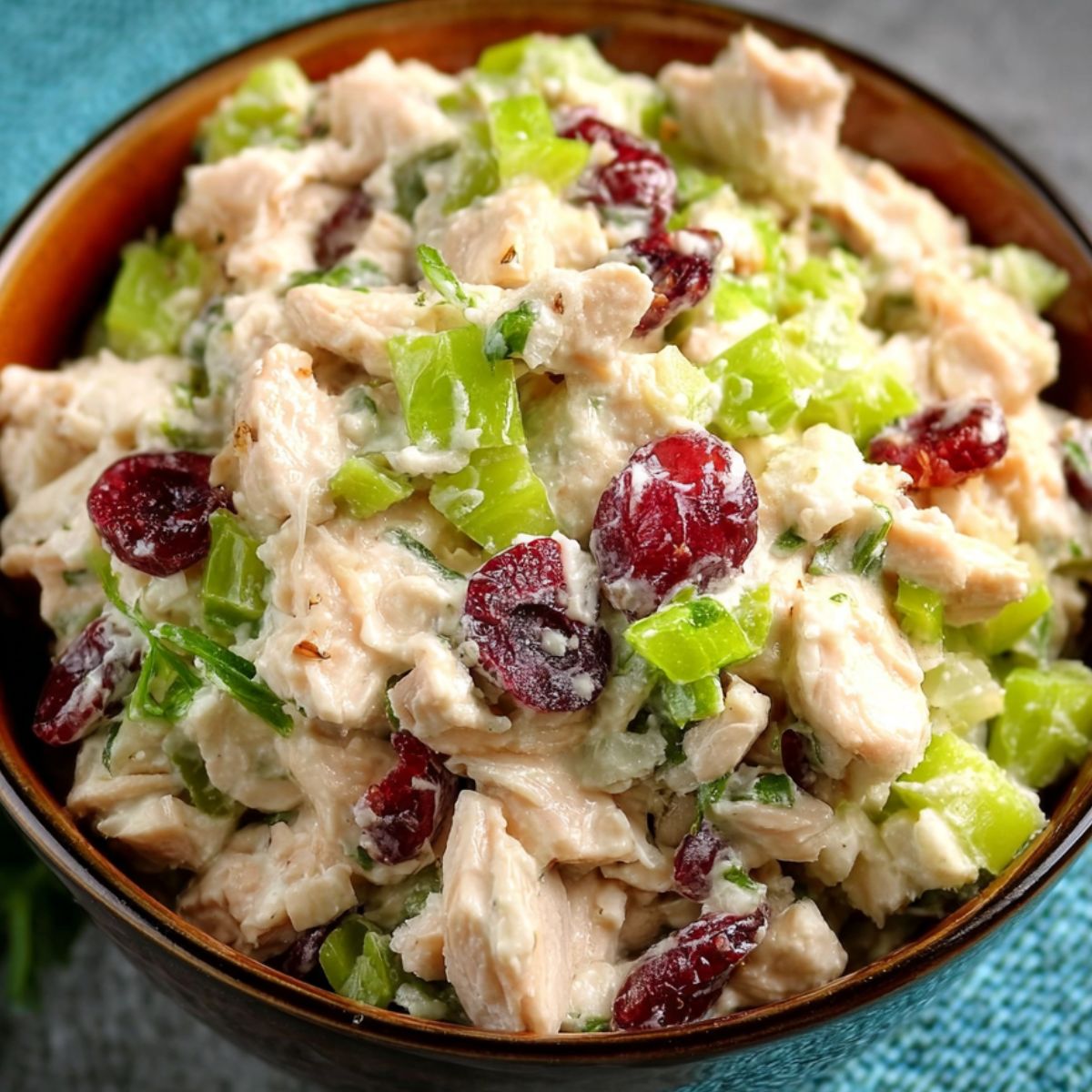Honey Mustard Chicken Salad Recipe The first image shows the finished chicken salad with ingredients like celery and cranberries, served in a bowl.