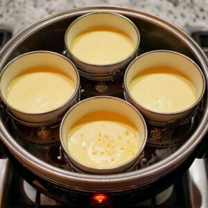 Healthy Chinese Steamed Eggs Recipe 16 The ramekins containing the steamed egg mixture, ready for steaming, inside a steamer.