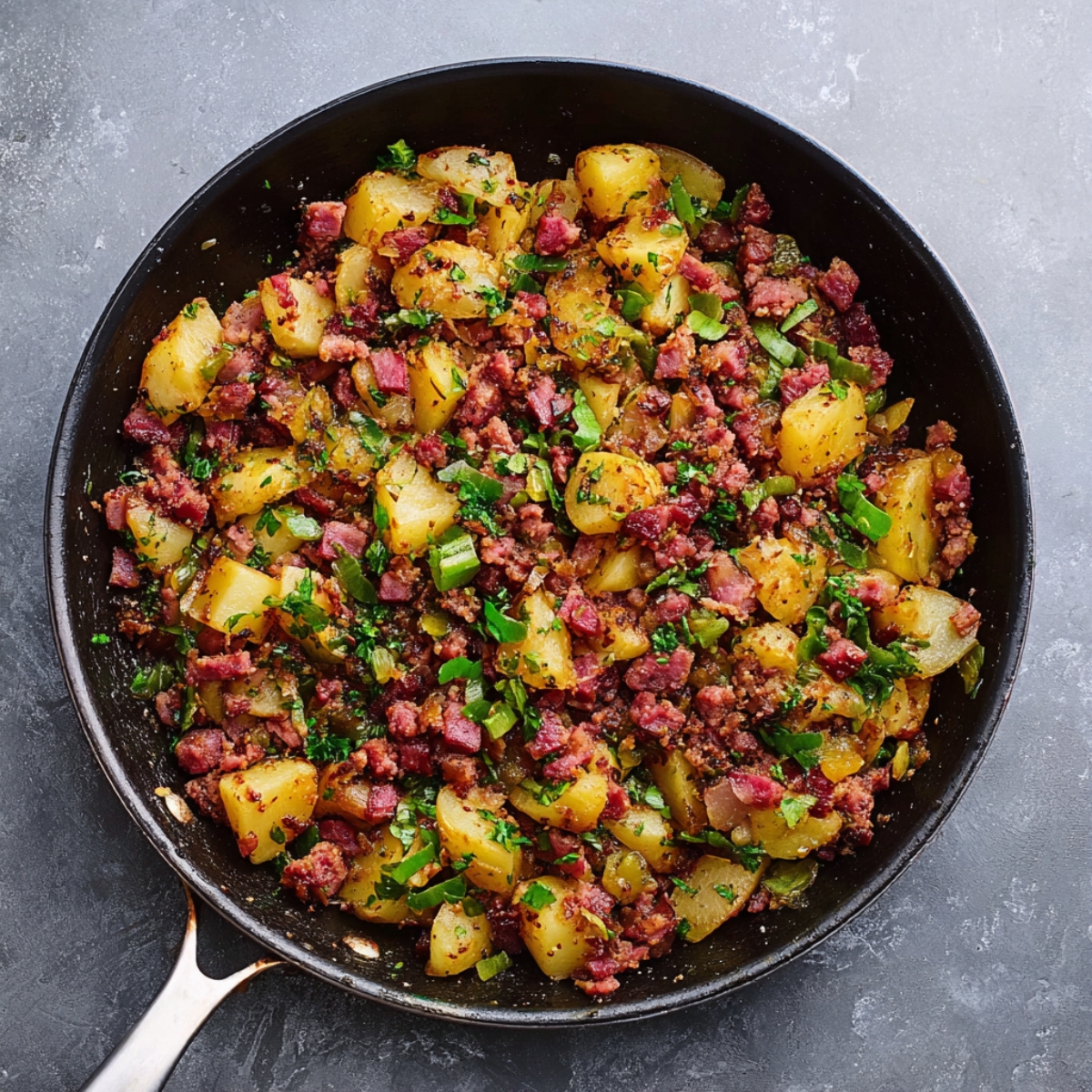 Easy Corned Beef Hash Recipe 13 Golden-brown corned beef hash with diced potatoes and herbs, cooked to perfection in a skillet.