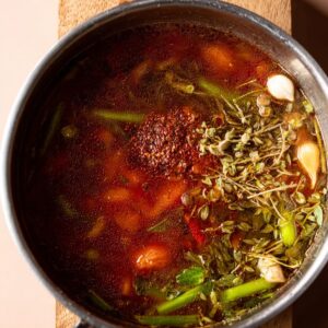 Delicious Vegan Lasagna Soup Recipe 16 A close-up shot of vegan lasagna soup with herbs and spices added for extra flavor