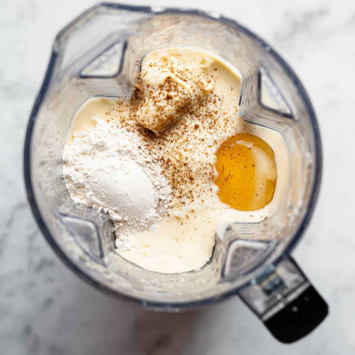 Healthy Homemade Blintzes Recipe 10 The ingredients for the batter are in a blender, ready to be mixed into a smooth, thin batter for making the crepes.