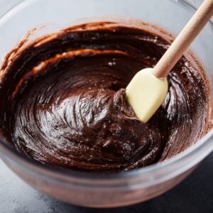 Healthy Heart Shaped Brownies Recipe 15 A smooth and glossy brownie batter in a mixing bowl, ready for baking into a delicious treat.