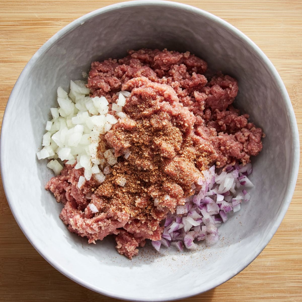 Easy Homemade Sliders Recipe 10 The meat mixture with ground beef, chopped onions, and seasonings, ready to be cooked.