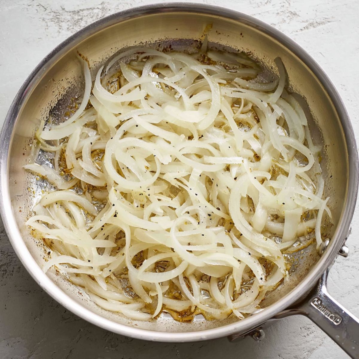 Best Squash Casserole Recipe 10 Thinly sliced onions sizzling in a stainless steel skillet, lightly browned and softened in butter or oil.