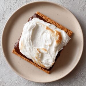 The marshmallow is toasted on top and chocolate melted underneath.